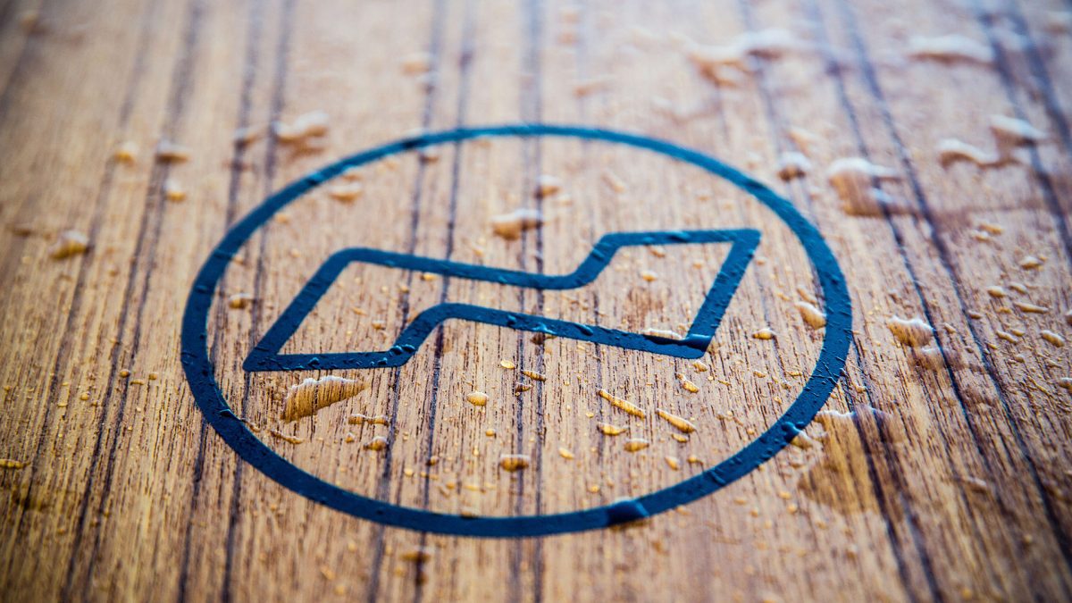 Nimbus logotype written on a piece of wood