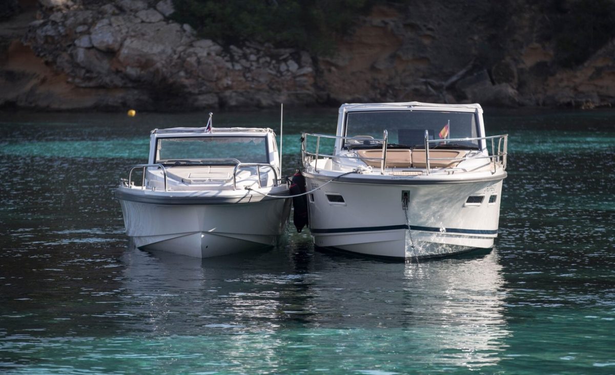 Two nimbus boats in Mallorca laying next to each other in the water